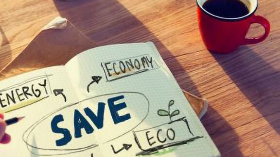 A hand-drawn infographic depicting environment sustainability laid out on a coffee table