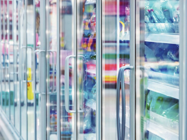 Commercial refrigerators in a line with products inside