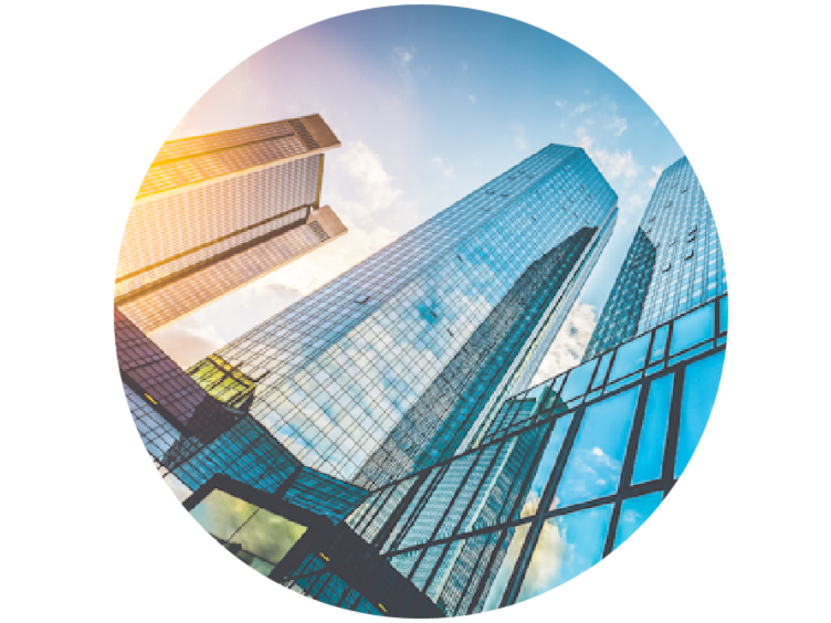 Frog's eye view of glass buildings on a sunny day